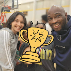 Coach P and Sarah smiling with a young player at a basketball event